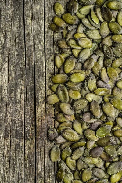 Geschilde Pompoenpitten Houten Ondergrond — Stockfoto