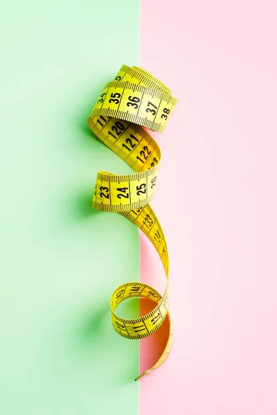 Yellow measuring tape of the tailor — Stock Photo, Image