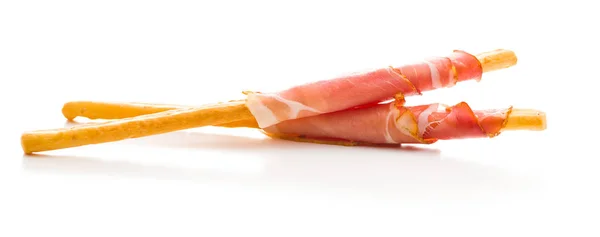 Parma ham prosciutto with grissini breadsticks. — Stock Photo, Image