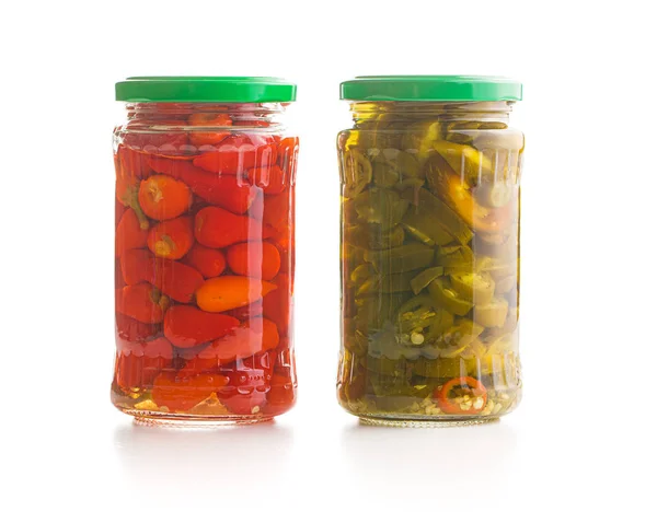 Pickled chili peppers and jalapeno peppers. — Stock Photo, Image