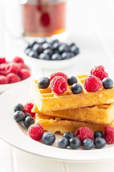 Waffles with blueberries and raspberries. — Stock Photo, Image