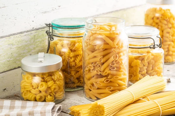 Various Types Raw Italian Pasta Jars Wooden Table — Stock Photo, Image