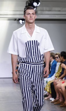 New York, NY, USA - July 9, 2018: A model walks runway for Carlos Campos Spring/Summer 2019 collection during NY Fashion Week: Mens at Industria Studios, Manhattan clipart