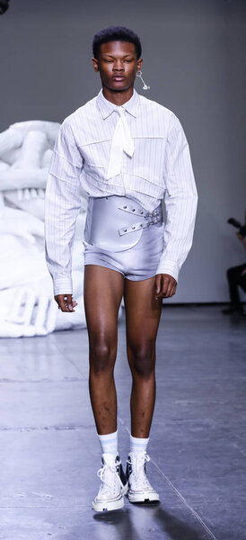 New York, NY, USA - July 10, 2018: A model walks runway for Feng Chen Wang Spring/Summer 2019 runway show during NY Fashion Wweek: Mens at Industria Studios, Manhattan