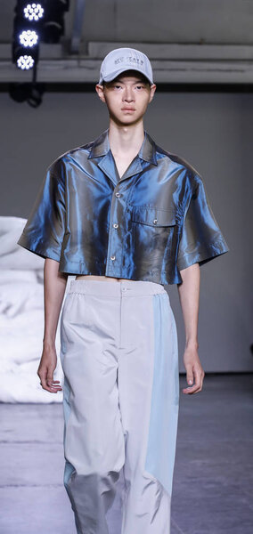 New York, NY, USA - July 10, 2018: A model walks runway for Feng Chen Wang Spring/Summer 2019 runway show during NY Fashion Wweek: Mens at Industria Studios, Manhattan