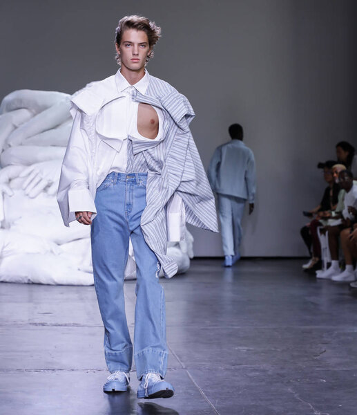 New York, NY, USA - July 10, 2018: A model walks runway for Feng Chen Wang Spring/Summer 2019 runway show during NY Fashion Wweek: Mens at Industria Studios, Manhattan