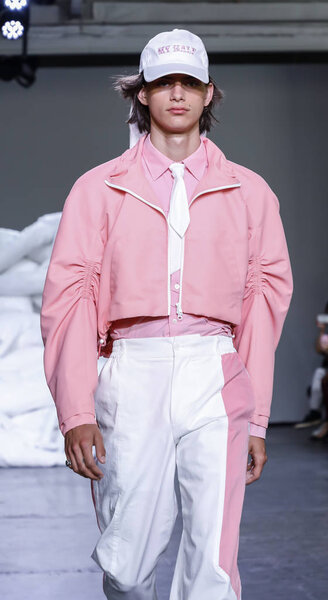 New York, NY, USA - July 10, 2018: A model walks runway for Feng Chen Wang Spring/Summer 2019 runway show during NY Fashion Wweek: Mens at Industria Studios, Manhattan