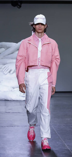 New York, NY, USA - July 10, 2018: A model walks runway for Feng Chen Wang Spring/Summer 2019 runway show during NY Fashion Wweek: Mens at Industria Studios, Manhattan