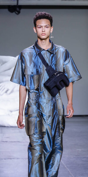 New York, NY, USA - July 10, 2018: A model walks runway for Feng Chen Wang Spring/Summer 2019 runway show during NY Fashion Wweek: Mens at Industria Studios, Manhattan