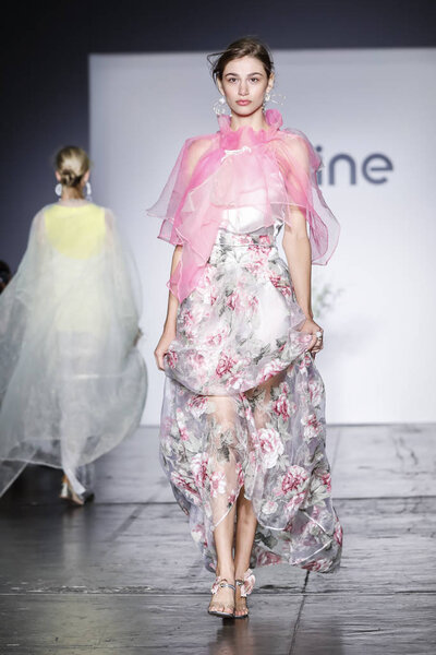 New York, USA - September 8, 2018: A model walks runway to present Jasmine by Jane Qin Spring/Summer 2019 collection during New York Fashion Week at Industria Studios, Manhattan