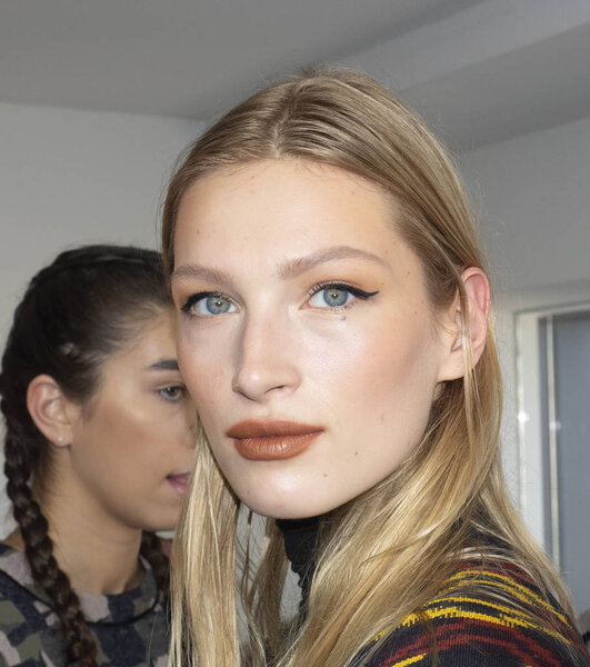 New York, NY, USA - February 8, 2019: A model prepares backstage for the  Cushnie Fall/Winter 2019 collection during New York Fashion at Spring Studios, Manhattan