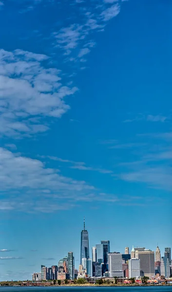 New York, NY, USA - September 20, 2020: View from Brooklyn, NY to Lower Manhattan skyline on the crisp Autumn day with plenty of blue sky