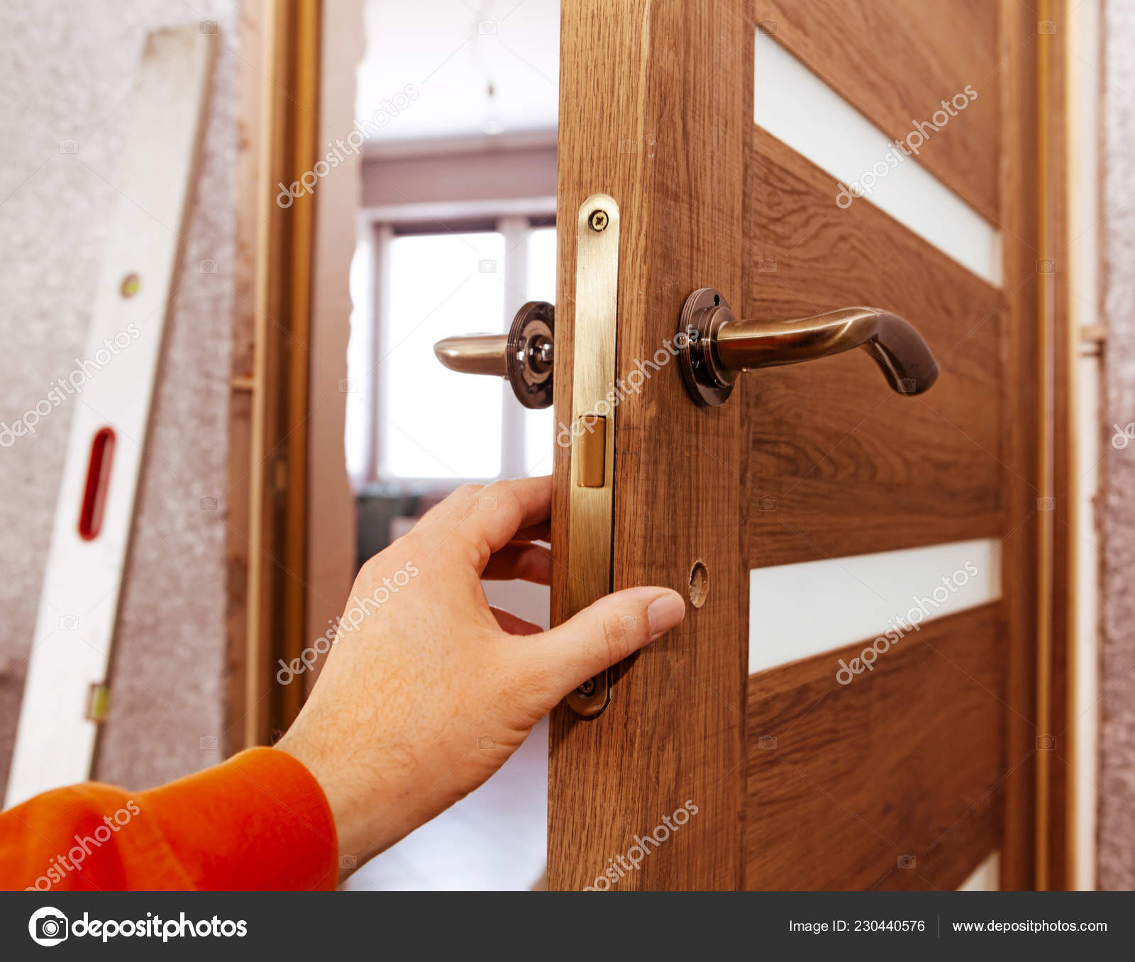 Hand Joiner Who Establishes Door Room Stock Photo by ©ssuaphoto 230440576