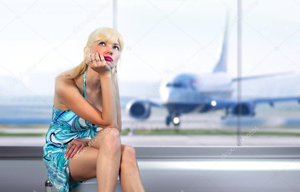 beautifu traveler misses with luggage in airport