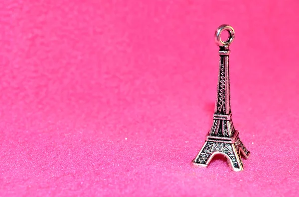 Eiffel Tower on a pink background. Paris. Iron Keychain.