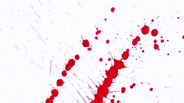 Manchas Vermelhas Salpicando Papel Branco — Vídeo de Stock