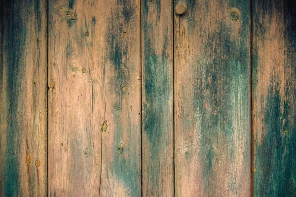 Старая блеклая краска на деревянных досках — стоковое фото
