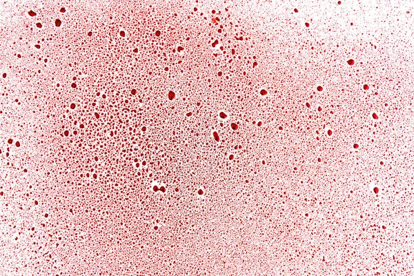 Rode druppels en blob's op een wit oppervlak — Stockfoto