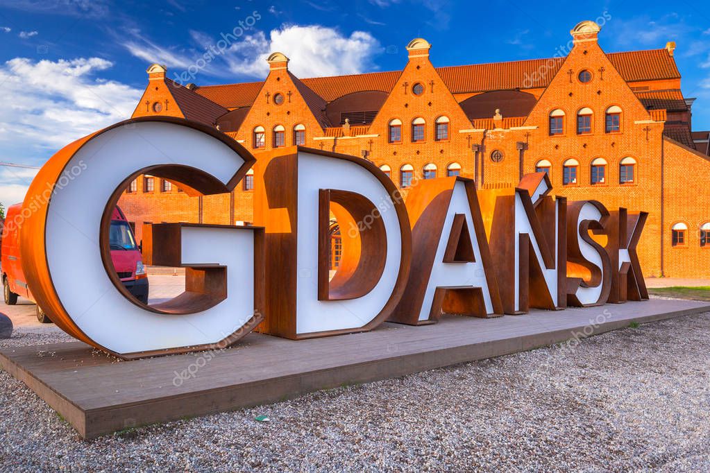 Gdansk city outdoor sign at sunrise, Poland