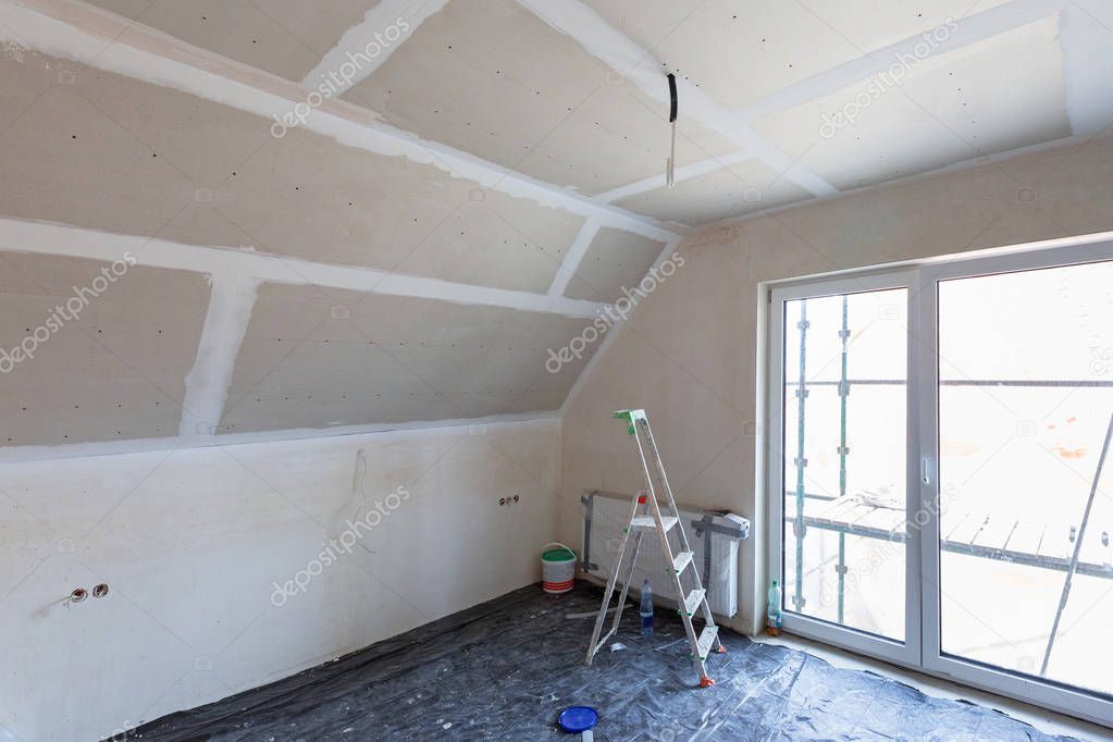 Empty bedroom interior with gypsum board ceiling at renovation