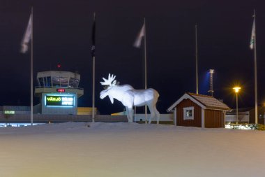 VAXJO, SWEDEN - JANUARY 19, 2018: Moose statue at the Vaxjo Smaland Airport in Sweden. this is an airport in southeastern Sweden, in the southern part of the province of Smaland. clipart