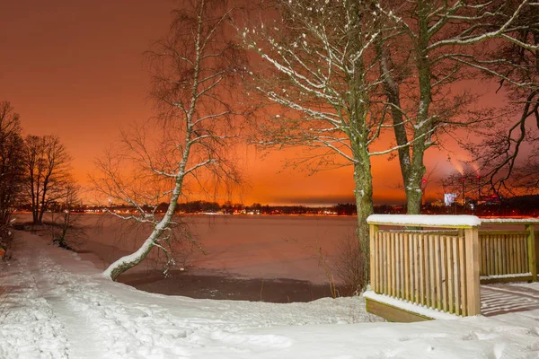 Winter scenery with frozen lake at night, Sweden