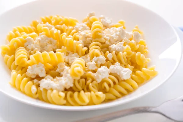 Homemade macaroni and white cottage cheese and sugar for kids
