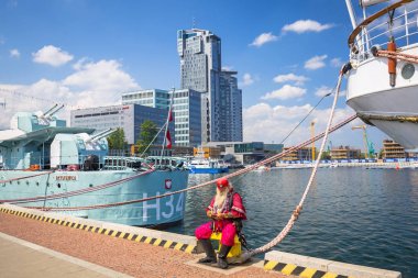 Gdynia, Poland - June 8, 2019: Pirate at the maritime museum ship Dar Pomorza at the Baltic Sea in Gdynia. This Polish sailing frigate was built in 1909 and served as a sail training ship. clipart