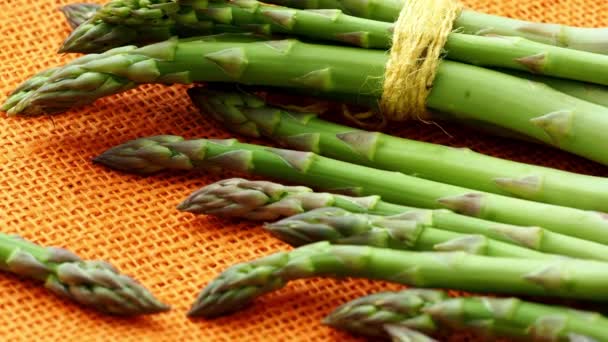 Fresh Asparagus Officinalis Isolated Orange Background Raw Garden Asparagus Stems — Stock Video