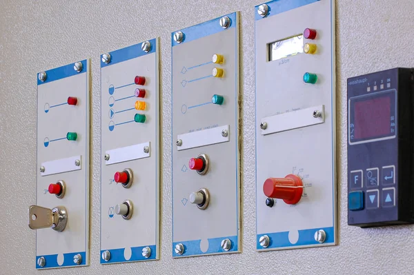Switches on an industrial control board. Lamp indicator and switch of power control panel.
