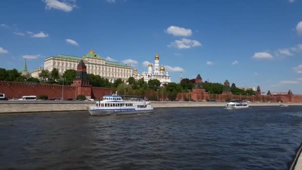 Moscow, Russia - May 12. 2018. Ships sail on river past the Kremlin — Stock Video