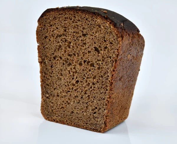 Large Piece Black Rye Bread Light Background — Stock Photo, Image