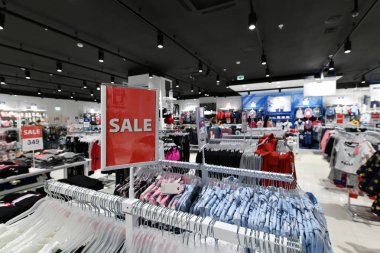 plate with information about sale and discount in interior of the store
