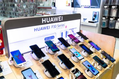 Moscow, Russia -May 15.2019. Huawei cell phones in shop window in MVideo store clipart