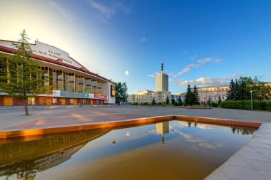 Arkhangelsk Drama Theatre named after Lomonosov. fountains and THE skyscrapper clipart