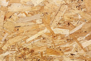 Osb panoları ahşap arka plan içine zıpkınlanmış kahverengi ahşap yongaları yapılır. Osb ahşap kaplama arka plan, sıkı, dikişsiz yüzeyler üst görünümü.