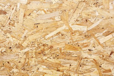 Osb panoları ahşap arka plan içine zıpkınlanmış kahverengi ahşap yongaları yapılır. Osb ahşap kaplama arka plan, sıkı, dikişsiz yüzeyler üst görünümü.