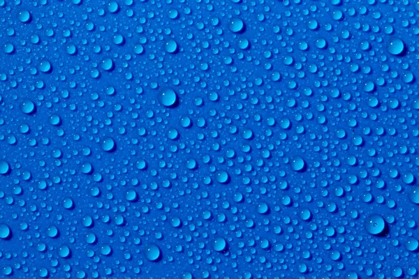 Salpicaduras Gotas Agua Sobre Fondo Azul —  Fotos de Stock