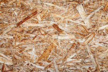 Preslenmiş yongaların ve talaş yakın çekimahşap yüzeyinin dokusu.