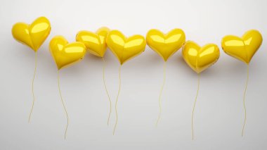 Beyaz arka planda şen sarı şişme balonlar.. 