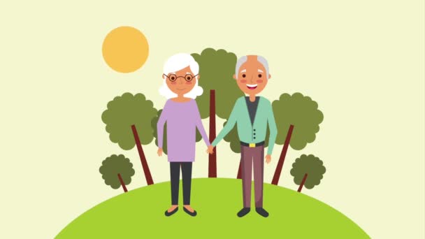 Cute older couple holding hands in the park — Stock Video
