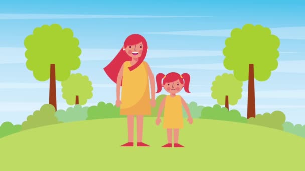 Mother and daughter standing in the park — Stock Video