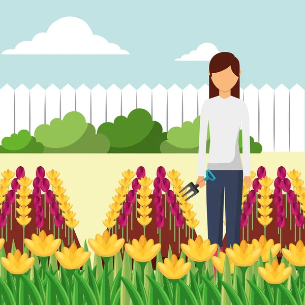 Mujer jardinero con tenedor trabajando en el jardín — Vector de stock