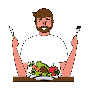 taze sebze ve çatal bıçak ile sakallı adam