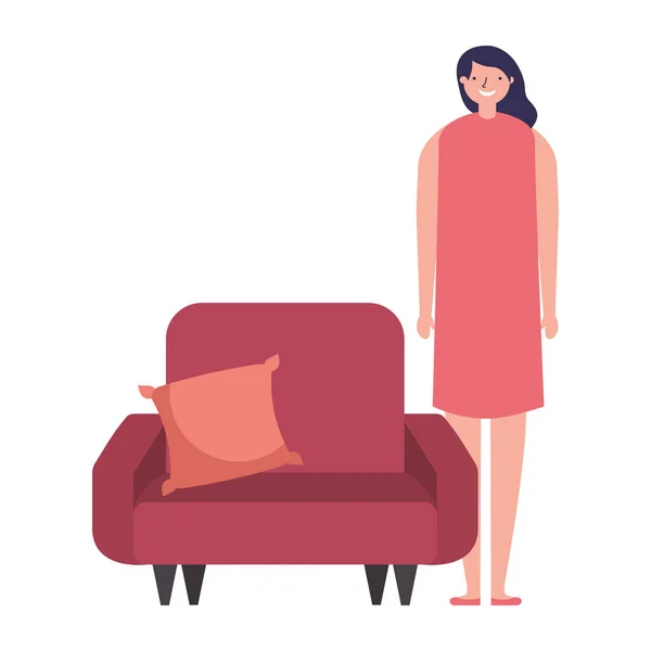 Mulher de pé perto do sofá com almofada —  Vetores de Stock