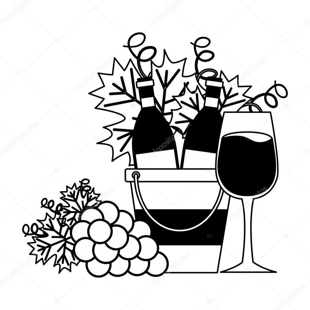 wine bottles ice bucket cup and grapes