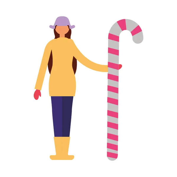 Femme en vêtements d'hiver tenant canne à bonbons — Image vectorielle