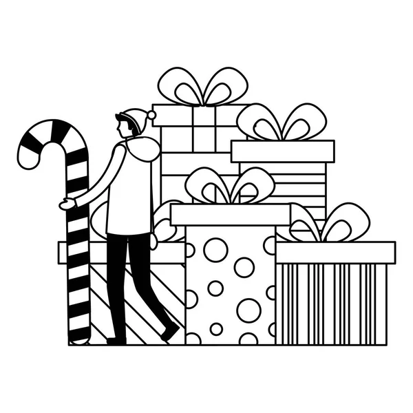 Man holding candy cane and stack gift boxes — Stock Vector