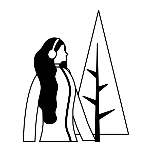Vrouw met hoofdtelefoon winterkleren en boom — Stockvector