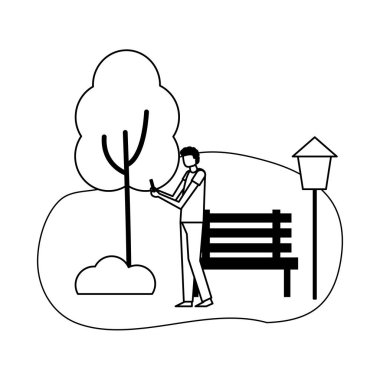 parkta telefon kullanan adam